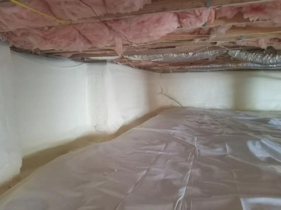 Crawl space encapsulation with closed-cell spray foam for Commercial Roof Restoration in Normal